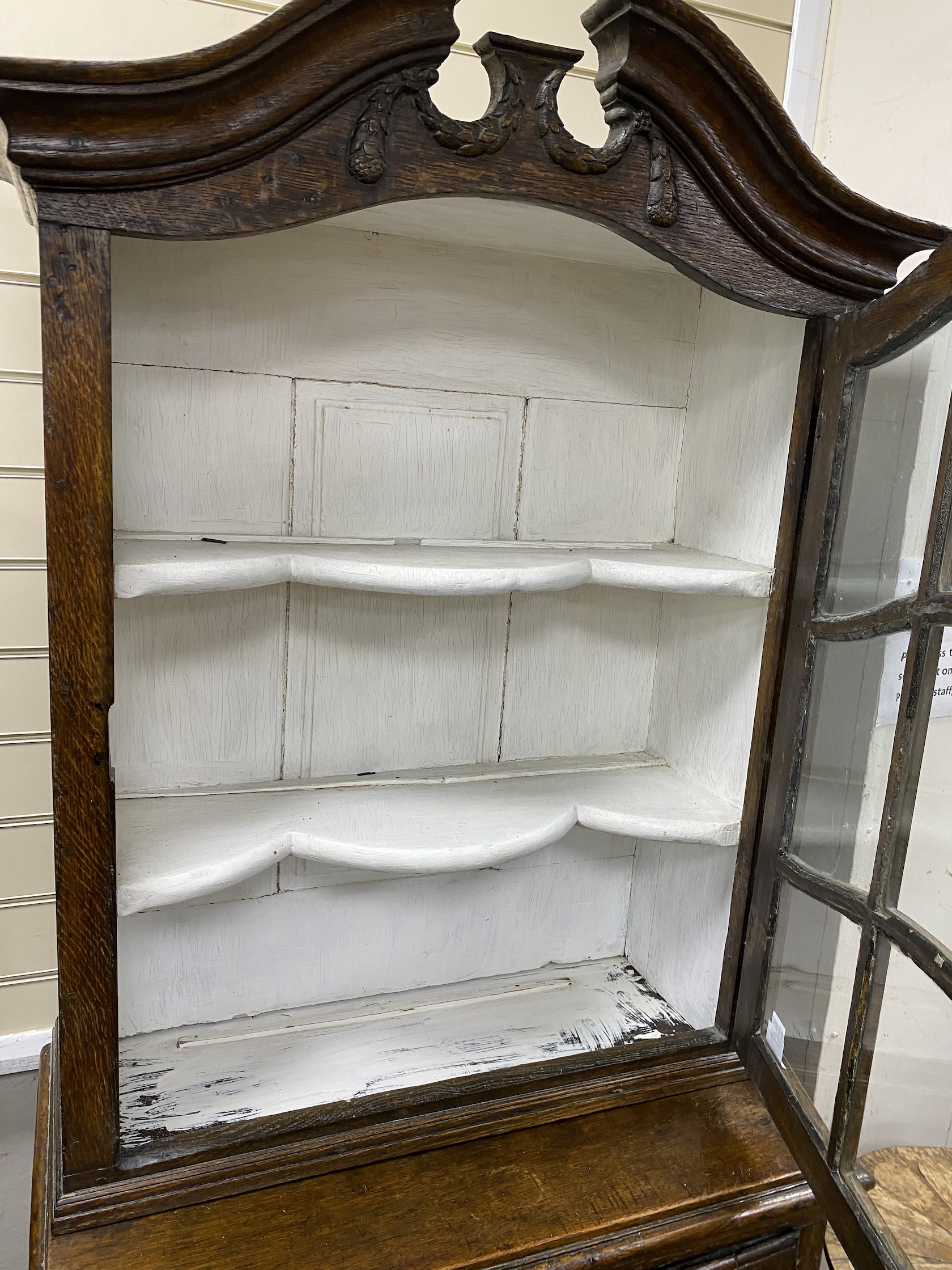 A late 18th / early 19th century Flemish Provincial glazed oak side cabinet, width 81cm, depth 46cm, height 196cm